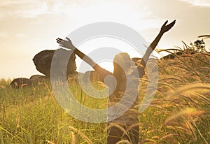 Young girl spreading hands with joy and inspiration