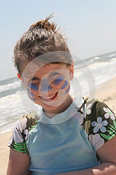 Young girl standing on the beach