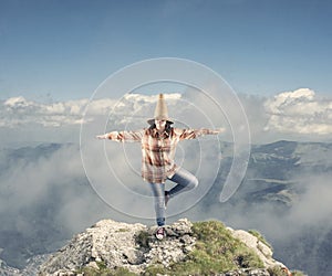 Young girl standing on one leg