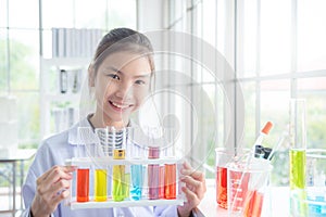 Young girl standing and smiles in chemistry classroom,education concept