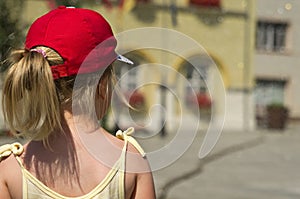 Young girl stood in street