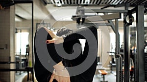 Young girl stretching body. warming up before training. young woman doing stretching exercise.fitness woman warming up before trai