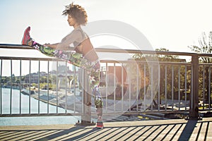 Young girl stretching outdoor.