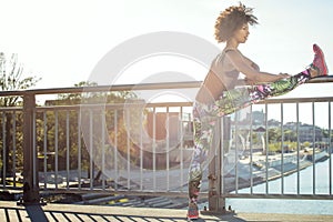 Young girl stretching outdoor.