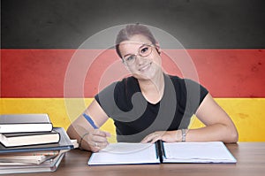 Young girl student on the background with germanl flag