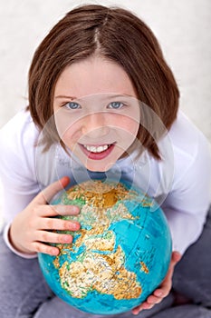 Young girl studying geography