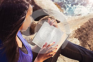 Young Girl Studying Her Bible Outdoors