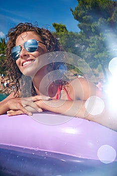 Young girl sunbathing on Adriatic waters