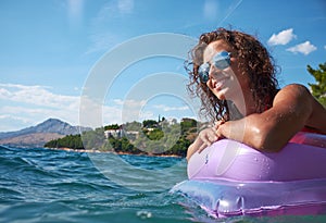 Young girl sunbathing on Adriatic waters