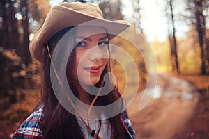 Young girl in sunny forest