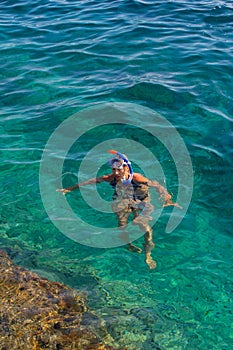 Young girl swiming in the sea