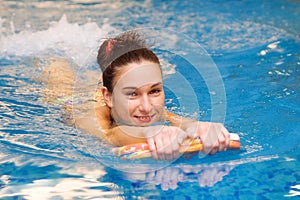 Young girl is swimming