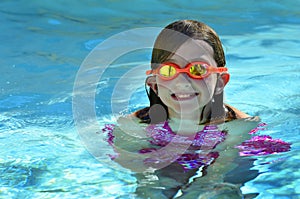 Young Girl Swimming with Goggles