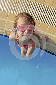 Young Girl at Swimming Pool Looking at Camera