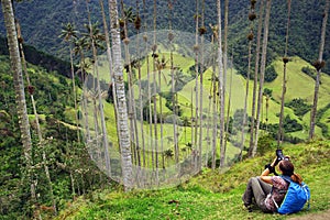 Young girl taking photos in Cocora valley in a cloudy day.