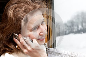Young girl takling by phone