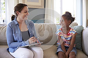 Young Girl Talking With Counselor At Home photo