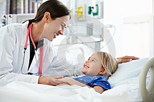 Young Girl Talking To Female Doctor In Intensive Care Unit