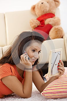 Young girl talking to her love on mobile
