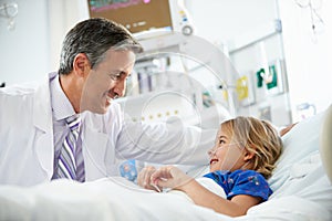Young Girl Talking To Male Doctor In Intensive Care Unit