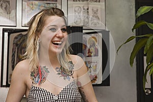 Young girl in tattoo parlor