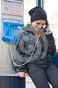 The young girl in telephone booth