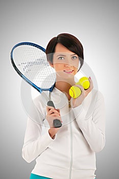 Young girl with tennis racket and bal