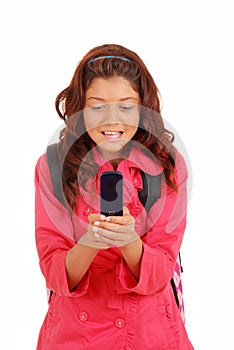 Young girl texting on cell phone