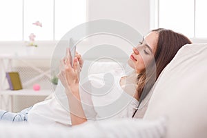 Young girl texting on smartphone