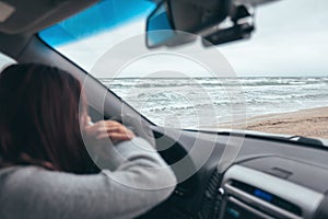 Car trip by cold sea in winter