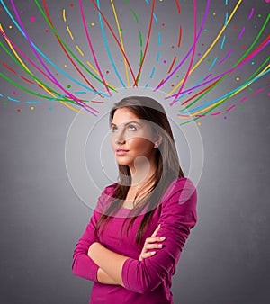 Young girl thinking with colorful abstract lines overhead