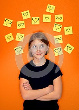 Young Girl Thinking and Sticky Notes photo