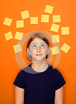 Young Girl Thinking and Sticky Notes photo