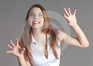 Young girl throws with fury and aggression. Emotional portrait of woman
