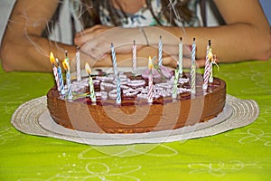 Young girl is to blow out candles