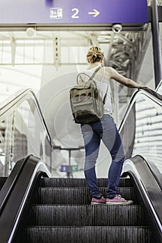 Young girl at the train station, travelling
