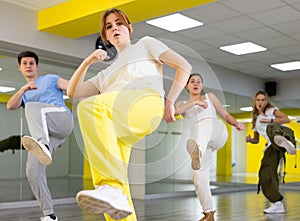 Young girl training breakdance Footwork moves in dance hall