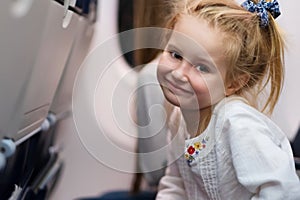 Young girl travelling by plane