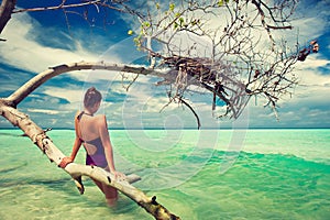 A young girl in a tropical sea