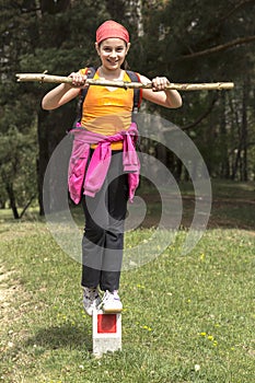 Young girl trying to keep balance