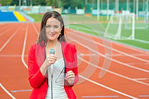 Young girl TV reporter is broadcasting photo