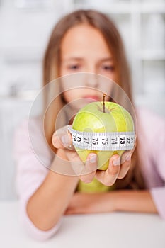 Young girl unhappy about her healthy diet choices - the effort of being fit