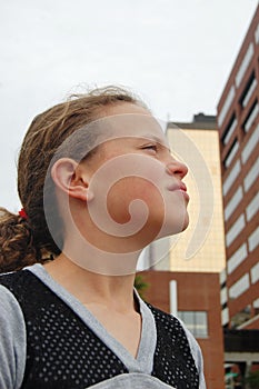 Young girl with urban enviornment in background