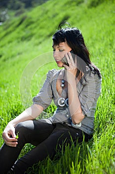 Young girl using cell phone outdoor