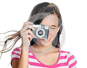 Young girl using a compact camera