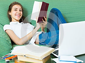 Young girl using laptop at home