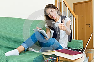 Young girl using laptop at home