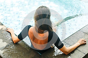 Young girl at the villa pool