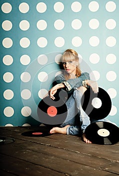 Young girl with vinyl records in the hands