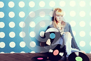 Young girl with vinyl records in the hands photo